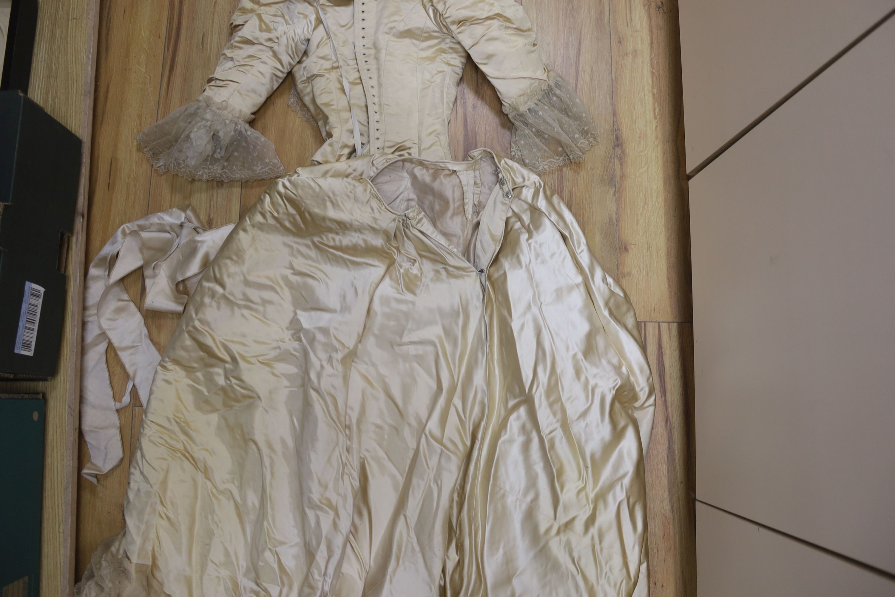 A Firth and Russell cream satin and lace wedding dress